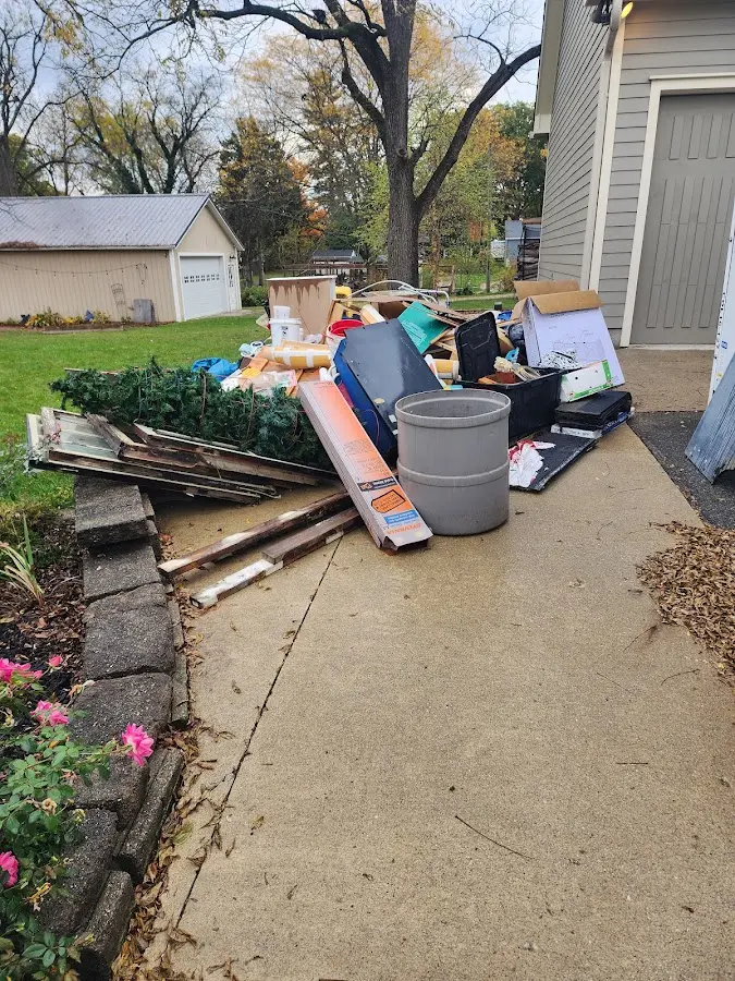 Dumpster being loaded with debris for 10 Yard Dumpster Rental in Barnwell